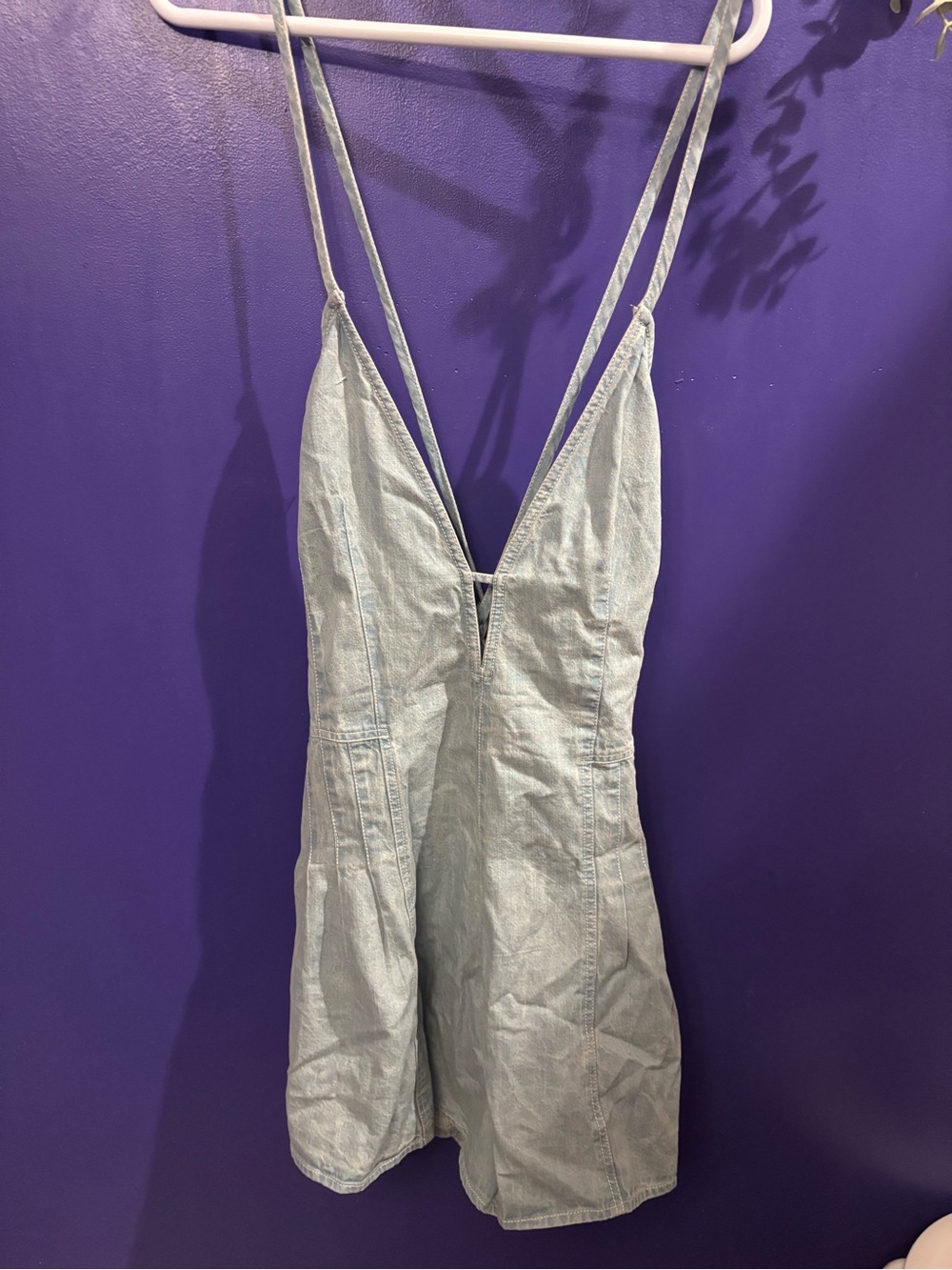 Free People Light Blue Denim Romper with Deep V Neck and Crossback Straps